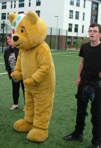 Pudsey and organiser, Lewis Christie, give the pre-match team talk.
