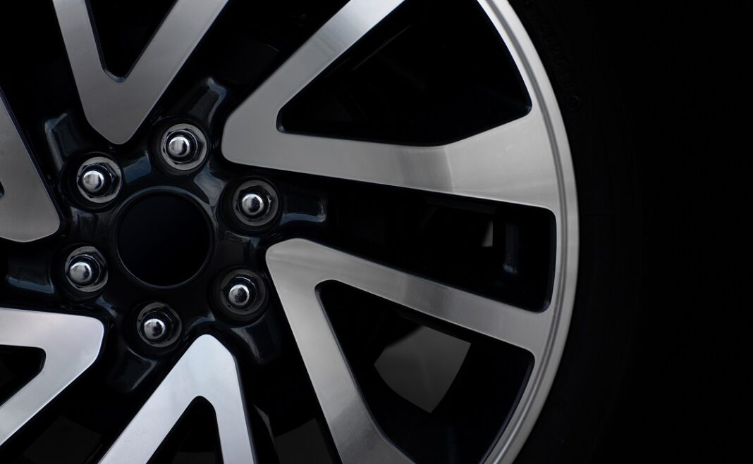 closeup alloy car wheels with soft-focus and over light in the background Why Volkswagen Owners in the England Are Upgrading Their Vans with VW T5 20 Inch Wheels