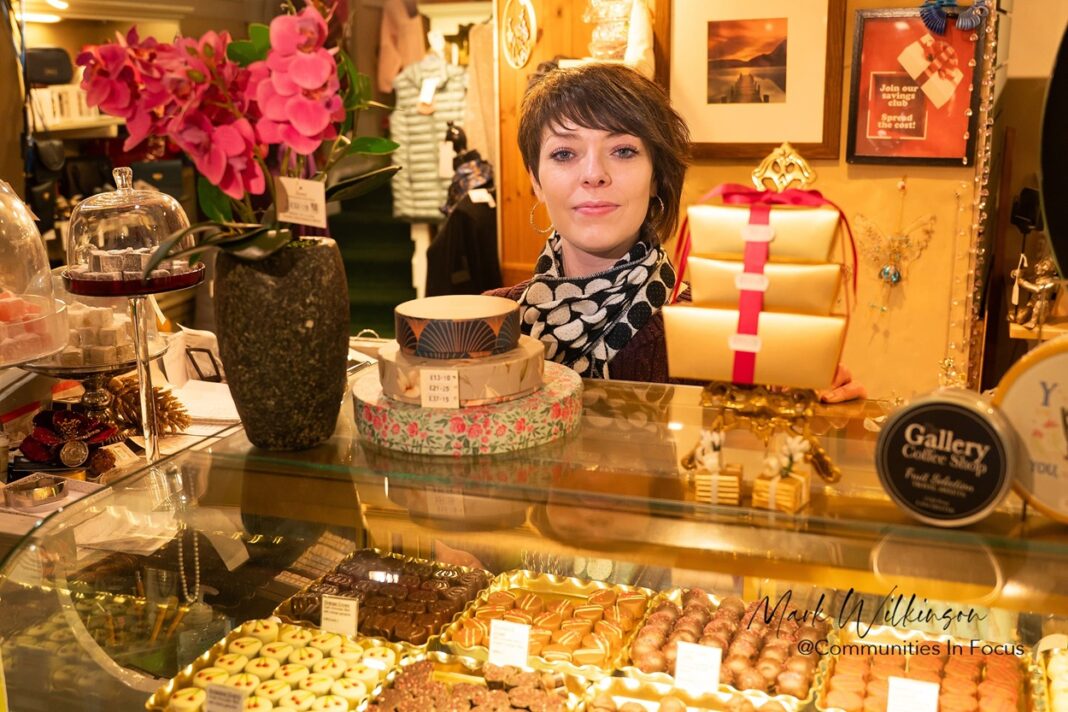 Inside Country Homes and Gifts with Steph Leithrow Steph Leithrow behind the counter surrounded by carefully selected gifts, homeware and sweet treats, reflecting the shop’s warm and personal touch. by Mark Wilkinson - Communities in Focus
