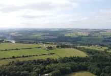 Jimmy Anderson of Ebchester An aerial view looking across Ebchester and the Derwent Valley, with farmland, hedgerows, woodland and scattered houses stretching to the horizon